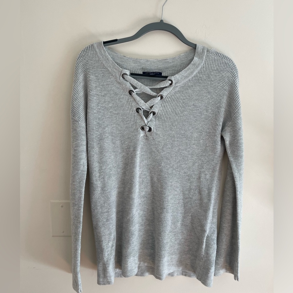 Grey knit sweater with corset scoop neck